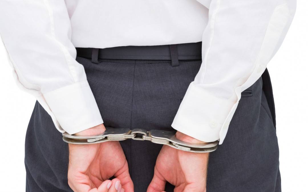 man handcuffed New Jersey Criminal Lawyers